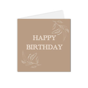 carte happy birthday et feuillage délicat sur fond caramel